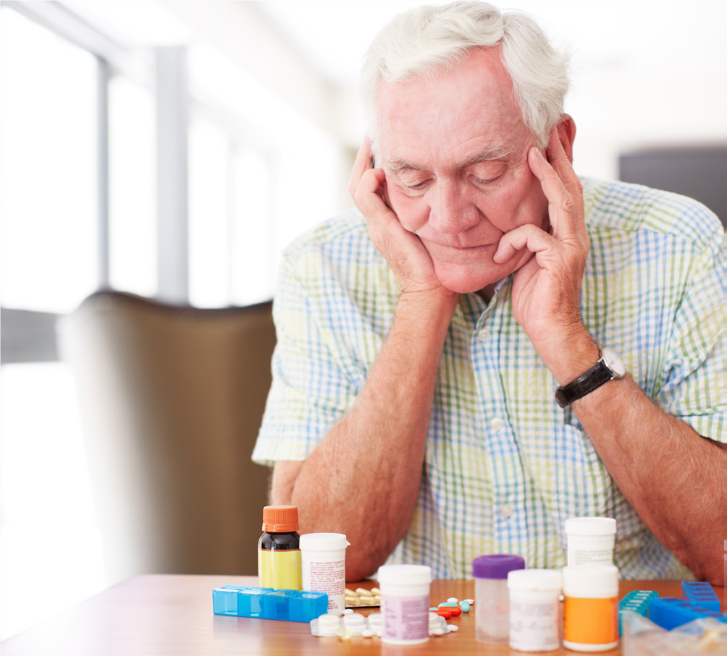 Elderly man confused about how to take his medicines.
